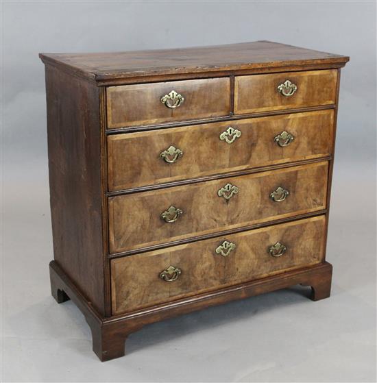 A George II crossbanded walnut chest, W.3ft D.1ft 8in. H.2ft 10.5in.